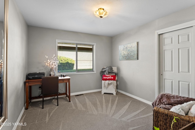 office featuring visible vents, baseboards, and carpet flooring