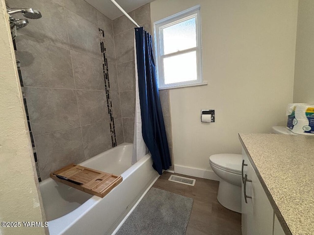 407 S 17th Ave, Yakima, WA 98902 - full bath featuring toilet, vanity, shower / tub combo, baseboards, and wood finished floors