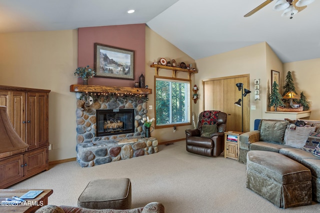 1013 Crest Acres Pl, Yakima, WA 98908 - carpeted living area with vaulted ceiling, a stone fireplace, a ceiling fan, and baseboards