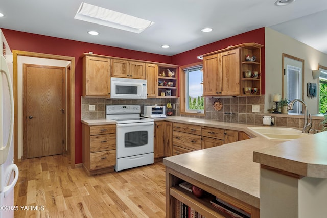 1013 Crest Acres Pl, Yakima, WA 98908 - kitchen with open shelves, white appliances, a sink, a peninsula, and recessed lighting