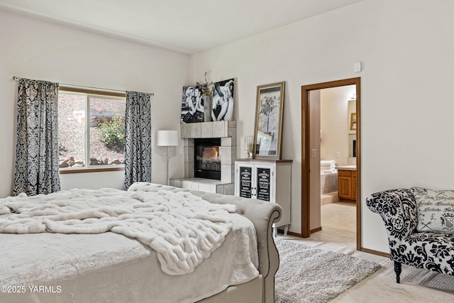 6 N 78th Ave, Yakima, WA 98908 - bedroom featuring a tile fireplace, light tile patterned flooring, ensuite bathroom, and light carpet