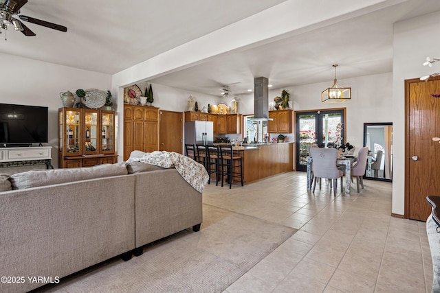 6 N 78th Ave, Yakima, WA 98908 - living area featuring ceiling fan, light tile patterned floors, and a chandelier