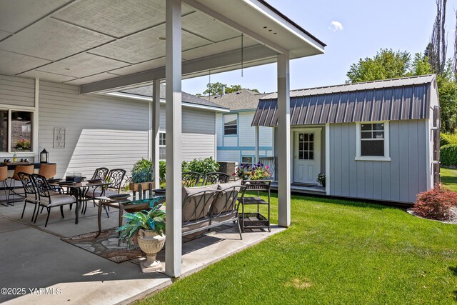 6 N 78th Ave, Yakima, WA 98908 - view of green lawn featuring an outdoor structure, a patio, and outdoor dining area