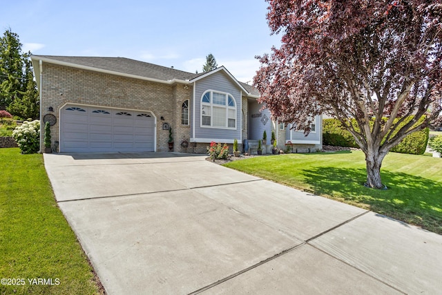 6 N 78th Ave, Yakima, WA 98908 - view of front of property featuring concrete driveway, a garage, brick siding, and a front lawn