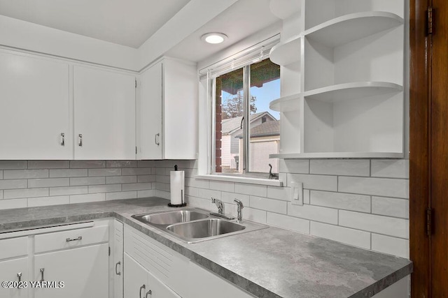 1501 W Chestnut Ave Unit 5, Yakima, WA 98902 - kitchen with open shelves, white cabinetry, and decorative backsplash