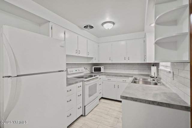 1501 W Chestnut Ave Unit 5, Yakima, WA 98902 - kitchen featuring white appliances, open shelves, white cabinetry, and backsplash