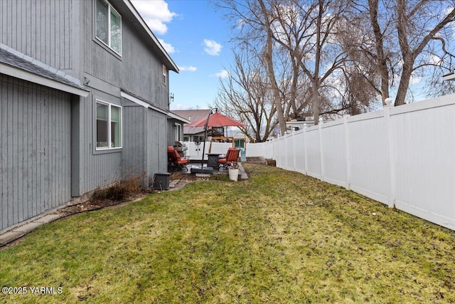 view of yard with a fenced backyard