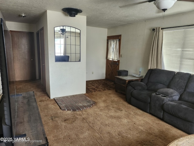 1202 W Viola Ave, Yakima, WA 98902 - carpeted living area featuring a ceiling fan and a textured ceiling