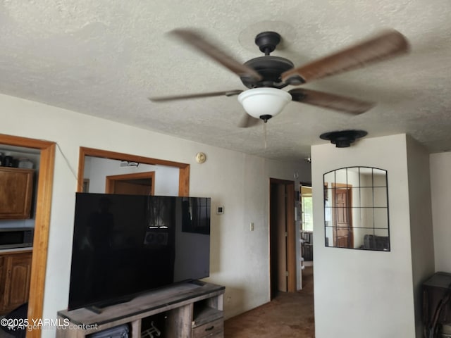 1202 W Viola Ave, Yakima, WA 98902 - carpeted living room with a textured ceiling and ceiling fan