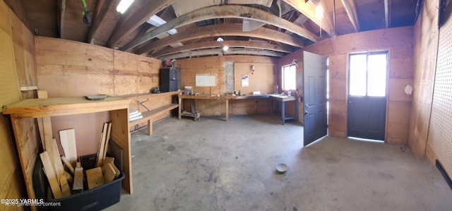 1202 W Viola Ave, Yakima, WA 98902 - miscellaneous room featuring a workshop area, concrete flooring, and lofted ceiling