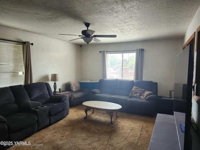 1202 W Viola Ave, Yakima, WA 98902 - carpeted living room with a ceiling fan and a textured ceiling