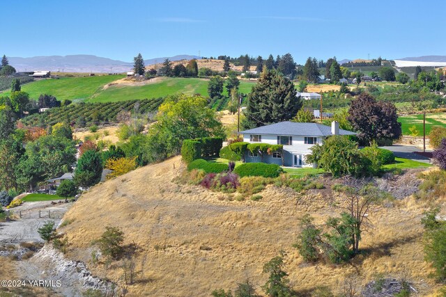 bird's eye view featuring a rural view and a mountain view