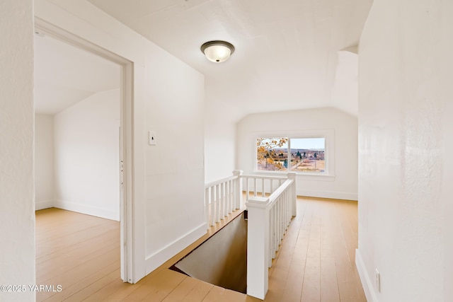 1555 W Tieton Rd, Tieton, WA 98947 - hall with an upstairs landing, light wood-style floors, vaulted ceiling, and baseboards