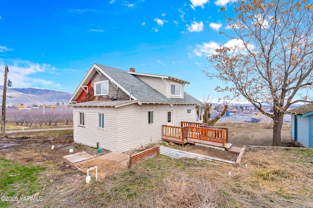 1555 W Tieton Rd, Tieton, WA 98947 - rear view of house with a deck and a shingled roof