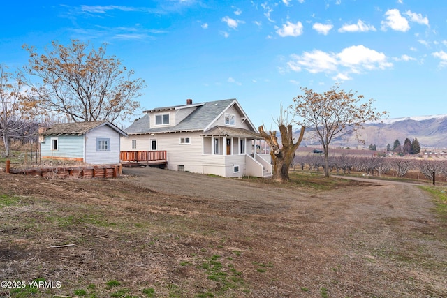 1555 W Tieton Rd, Tieton, WA 98947 - rear view of property with a chimney and a deck with mountain view