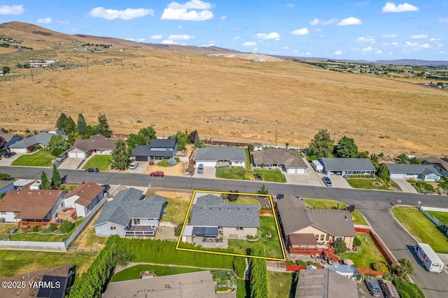 602 N 57th Ave, Yakima, WA 98901 - aerial perspective of suburban area featuring property boundaries highlighted and a mountainous background