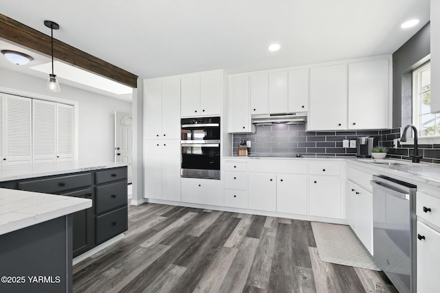 15014 Fisk Rd, Yakima, WA 98908 - kitchen with a sink, stainless steel dishwasher, multiple ovens, decorative backsplash, and recessed lighting