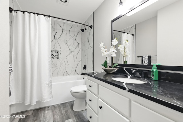 15014 Fisk Rd, Yakima, WA 98908 - bathroom featuring vanity, shower / bath combination with curtain, toilet, and wood finished floors