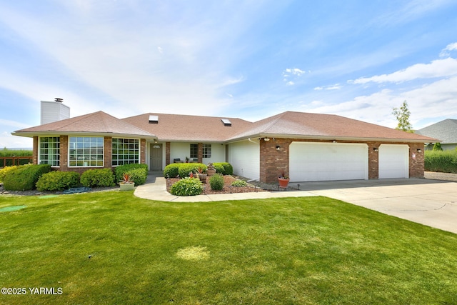 15014 Fisk Rd, Yakima, WA 98908 - single story home featuring brick siding, an attached garage, concrete driveway, a chimney, and a front lawn