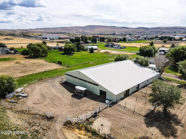 aerial view featuring a rural view and a mountain view