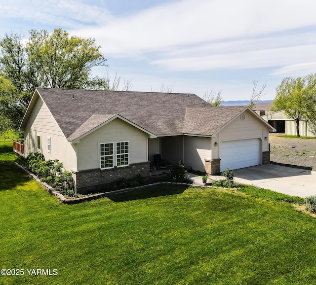 131 Latigo Ln, Yakima, WA 98901 - ranch-style home featuring brick siding, an attached garage, a shingled roof, driveway, and a front lawn