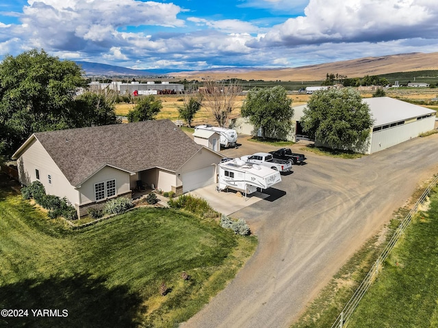 birds eye view of property featuring a mountain view