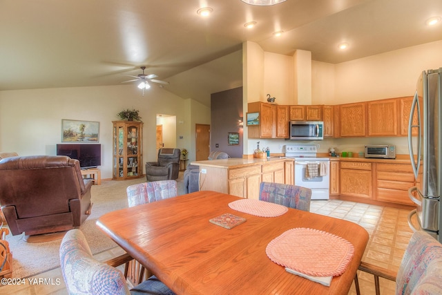131 Latigo Ln, Yakima, WA 98901 - dining room with a ceiling fan, high vaulted ceiling, and light tile patterned floors