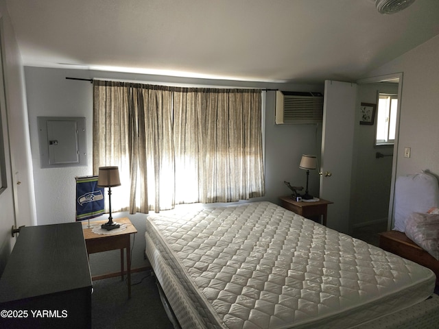 13520 Fisk Rd, Yakima, WA 98908 - carpeted bedroom with electric panel, a wall mounted air conditioner, and vaulted ceiling
