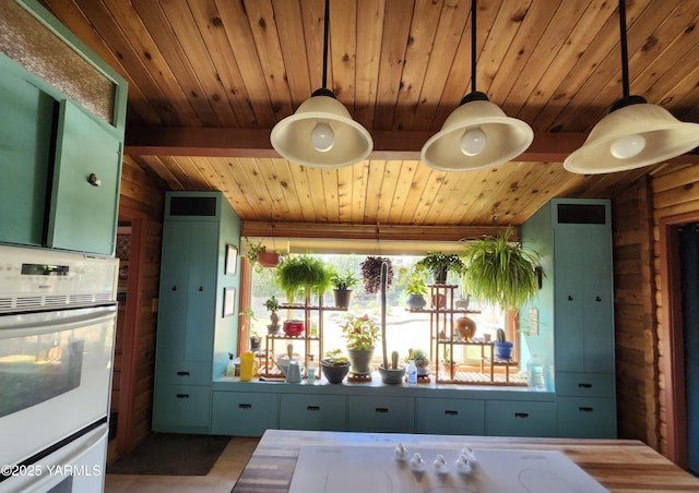 13520 Fisk Rd, Yakima, WA 98908 - kitchen featuring white oven, wood ceiling, and decorative light fixtures