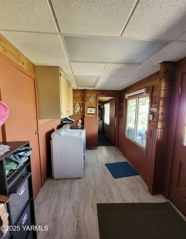 13520 Fisk Rd, Yakima, WA 98908 - laundry area featuring wood walls, washer / clothes dryer, and light wood finished floors