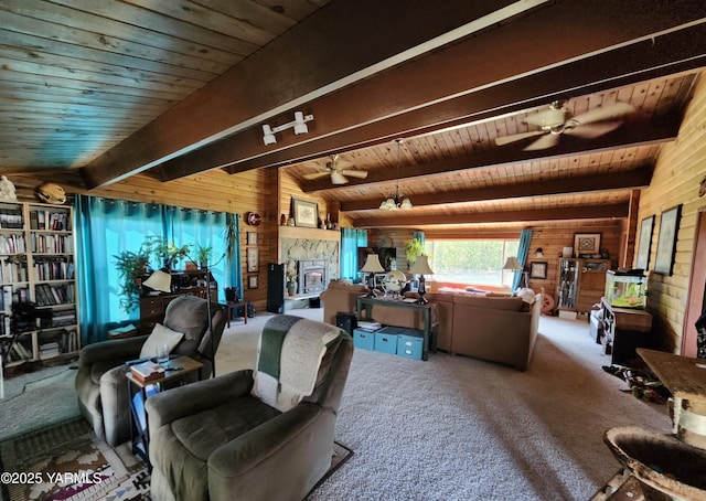 13520 Fisk Rd, Yakima, WA 98908 - carpeted living area featuring wood walls, a wooden ceiling with exposed beams, and a ceiling fan