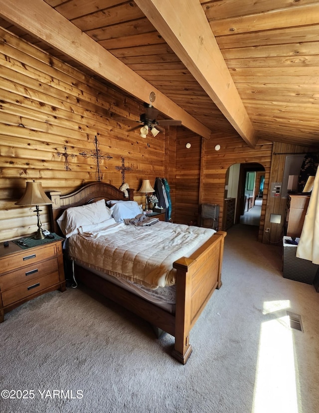 13520 Fisk Rd, Yakima, WA 98908 - carpeted bedroom with a wood ceiling with exposed beams, wood walls, and arched walkways