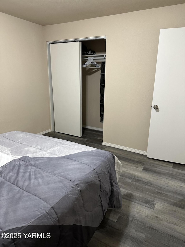 205 N 63rd Ave, Yakima, WA 98908 - bedroom featuring wood finished floors, a closet, and baseboards