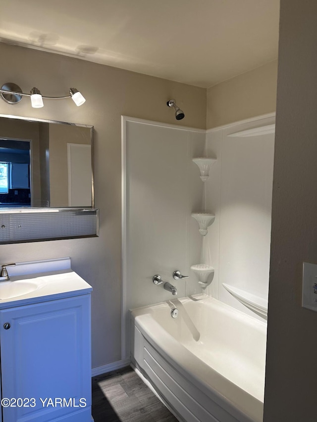 205 N 63rd Ave, Yakima, WA 98908 - full bathroom featuring vanity, tub / shower combination, and wood finished floors