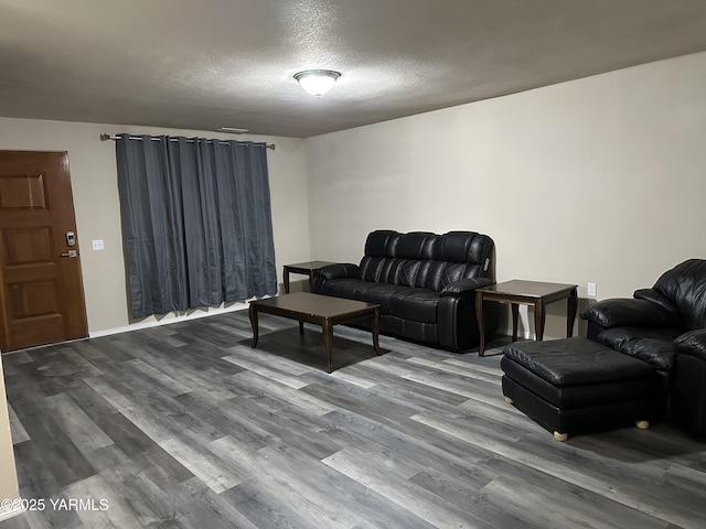 205 N 63rd Ave, Yakima, WA 98908 - living room with dark wood-type flooring and a textured ceiling