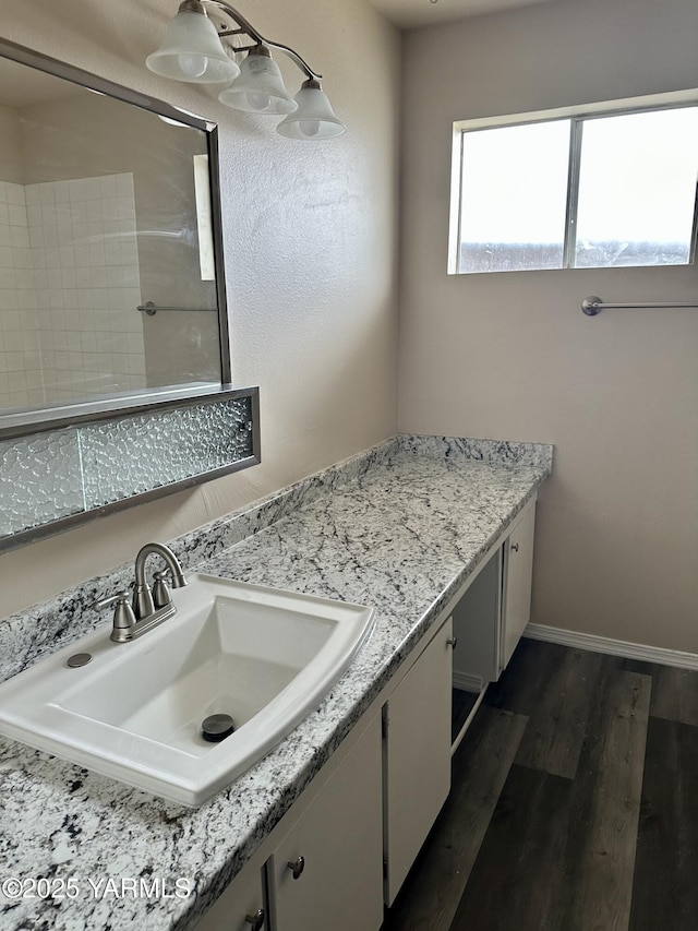 205 N 63rd Ave, Yakima, WA 98908 - bathroom featuring wood finished floors, vanity, and baseboards