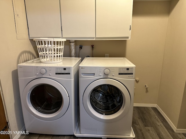 205 N 63rd Ave, Yakima, WA 98908 - washroom with dark wood-type flooring, washer and clothes dryer, baseboards, and cabinet space