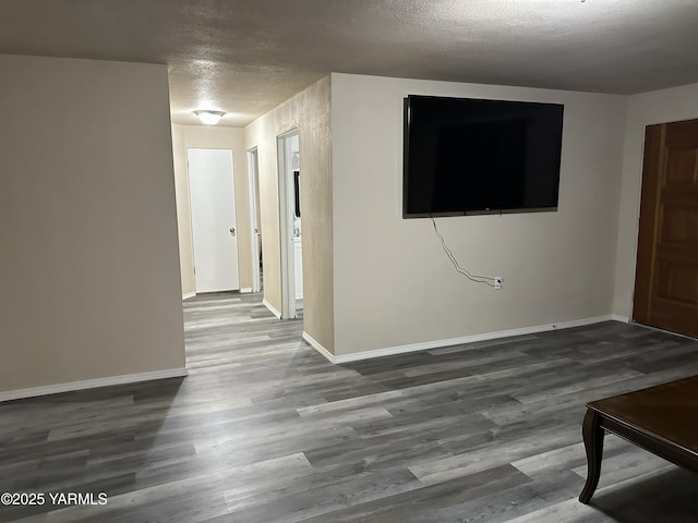 205 N 63rd Ave, Yakima, WA 98908 - foyer with a textured ceiling, wood finished floors, and baseboards