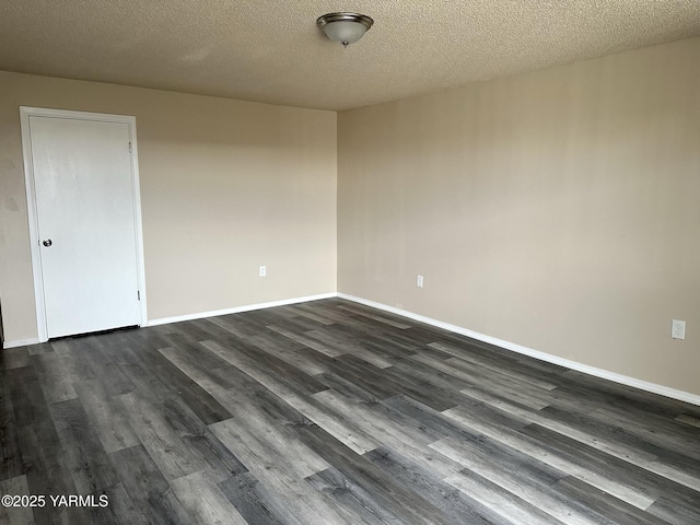 205 N 63rd Ave, Yakima, WA 98908 - unfurnished room with dark wood-style floors, baseboards, and a textured ceiling