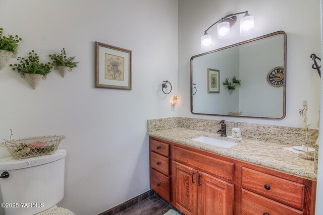 1008 S 90th Ave, Yakima, WA 98908 - half bath featuring vanity, toilet, and baseboards