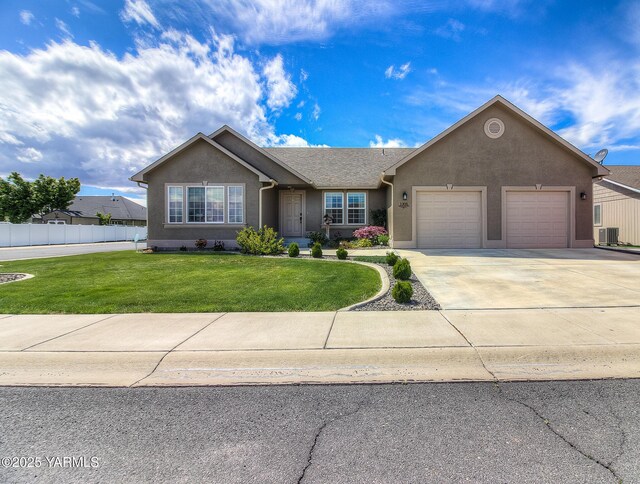 1008 S 90th Ave, Yakima, WA 98908 - single story home with an attached garage, central AC, stucco siding, and concrete driveway
