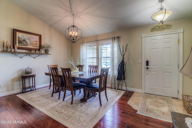 1008 S 90th Ave, Yakima, WA 98908 - dining space with dark wood-style flooring, a chandelier, and baseboards