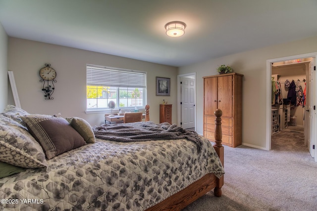 1008 S 90th Ave, Yakima, WA 98908 - bedroom with light carpet, a walk in closet, and baseboards