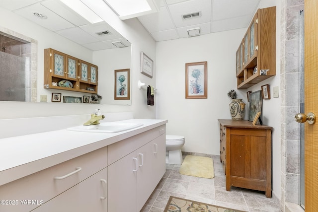 1011 N 42nd Pl, Yakima, WA 98908 - full bathroom featuring a drop ceiling, vanity, and tiled shower