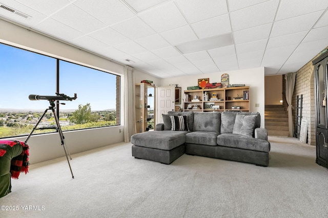 1011 N 42nd Pl, Yakima, WA 98908 - carpeted living area featuring a paneled ceiling and stairs
