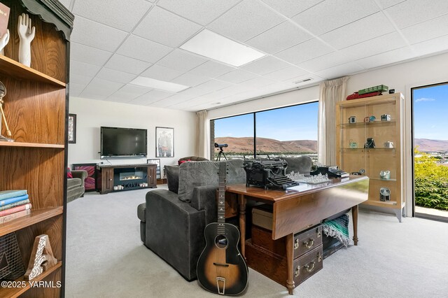 1011 N 42nd Pl, Yakima, WA 98908 - carpeted living area featuring a paneled ceiling and a mountain view