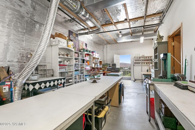 1011 N 42nd Pl, Yakima, WA 98908 - miscellaneous room with a workshop area and concrete floors