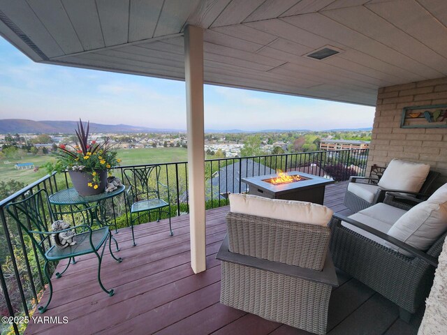 1011 N 42nd Pl, Yakima, WA 98908 - wooden terrace with a fire pit and a mountain view