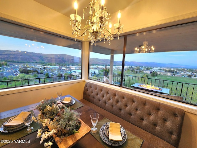 1011 N 42nd Pl, Yakima, WA 98908 - dining room featuring a chandelier, a mountain view, and wood finished floors