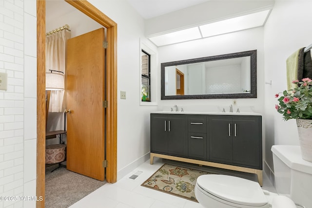 1011 N 42nd Pl, Yakima, WA 98908 - bathroom with double vanity and tile patterned flooring